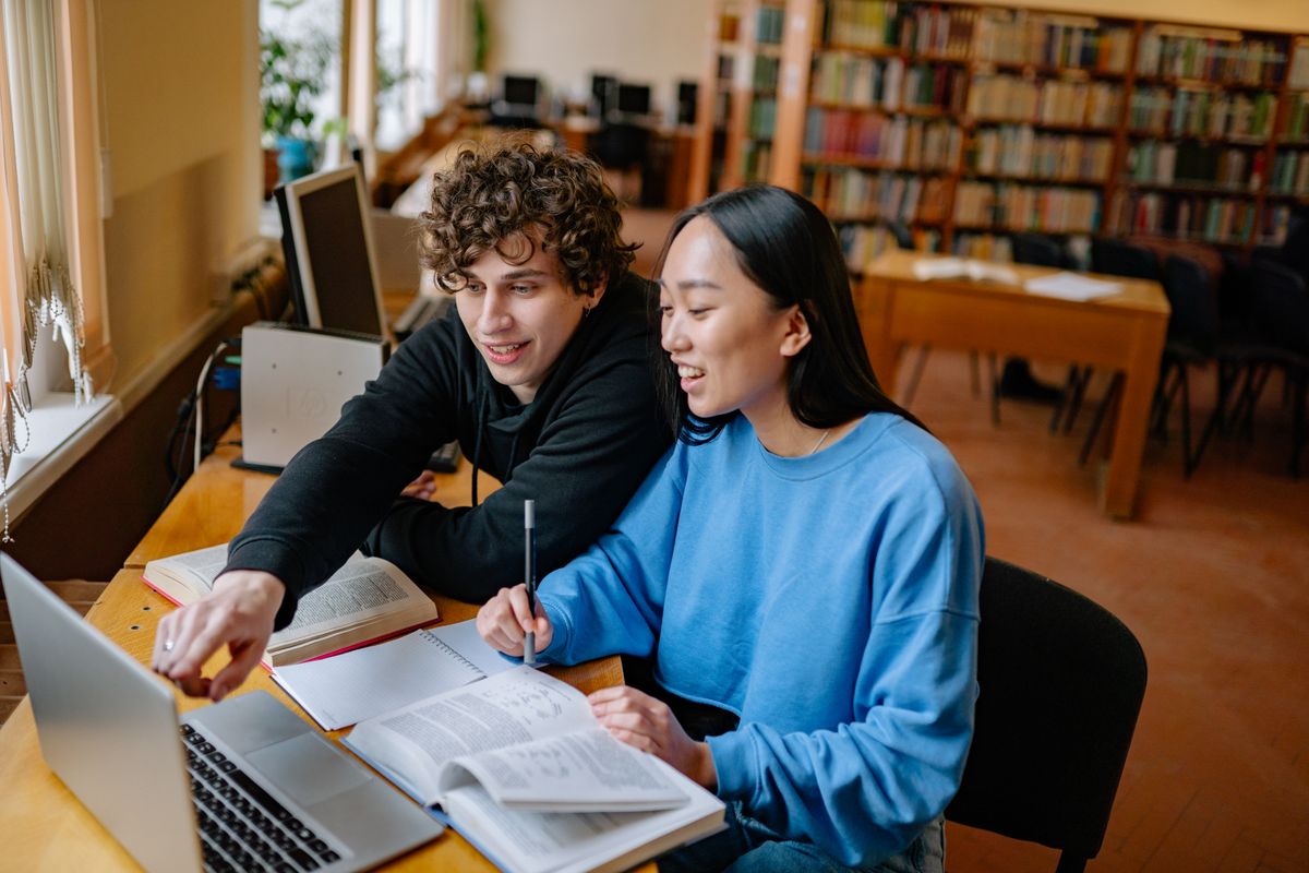 Students exploring ideas together in a library